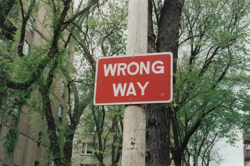 wrong way sign - Employee Misclassification: How to Avoid Contractor Classification Risk