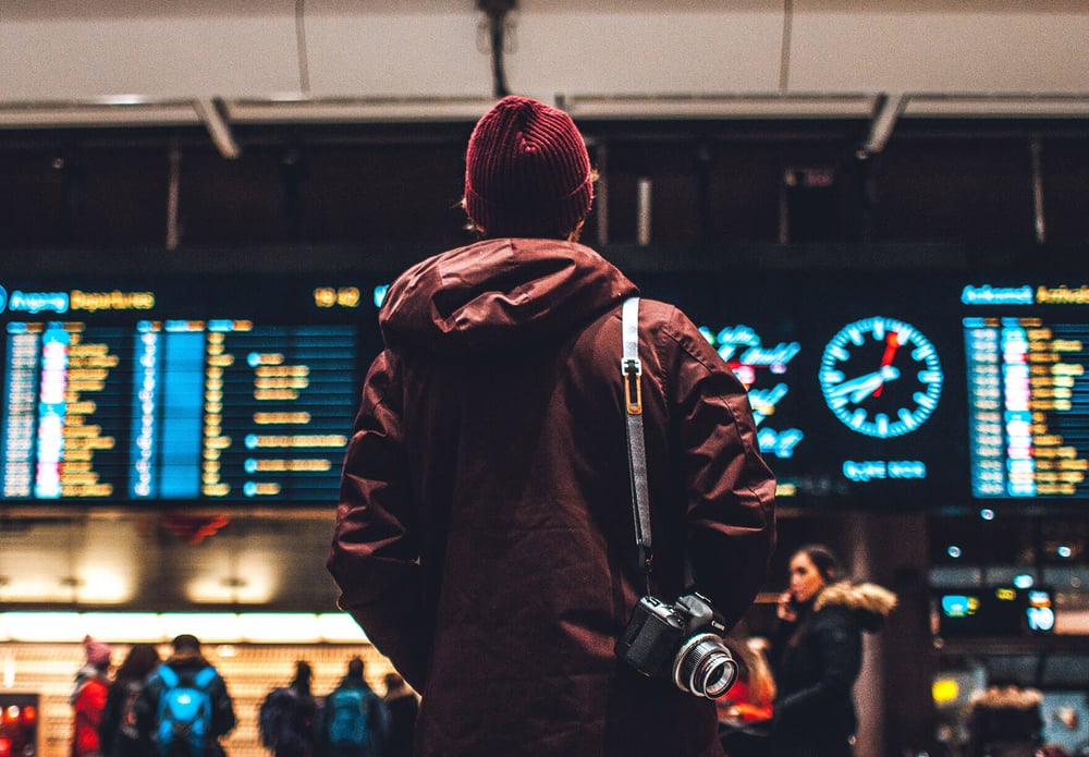 Employee preparing for international relocation at an airport