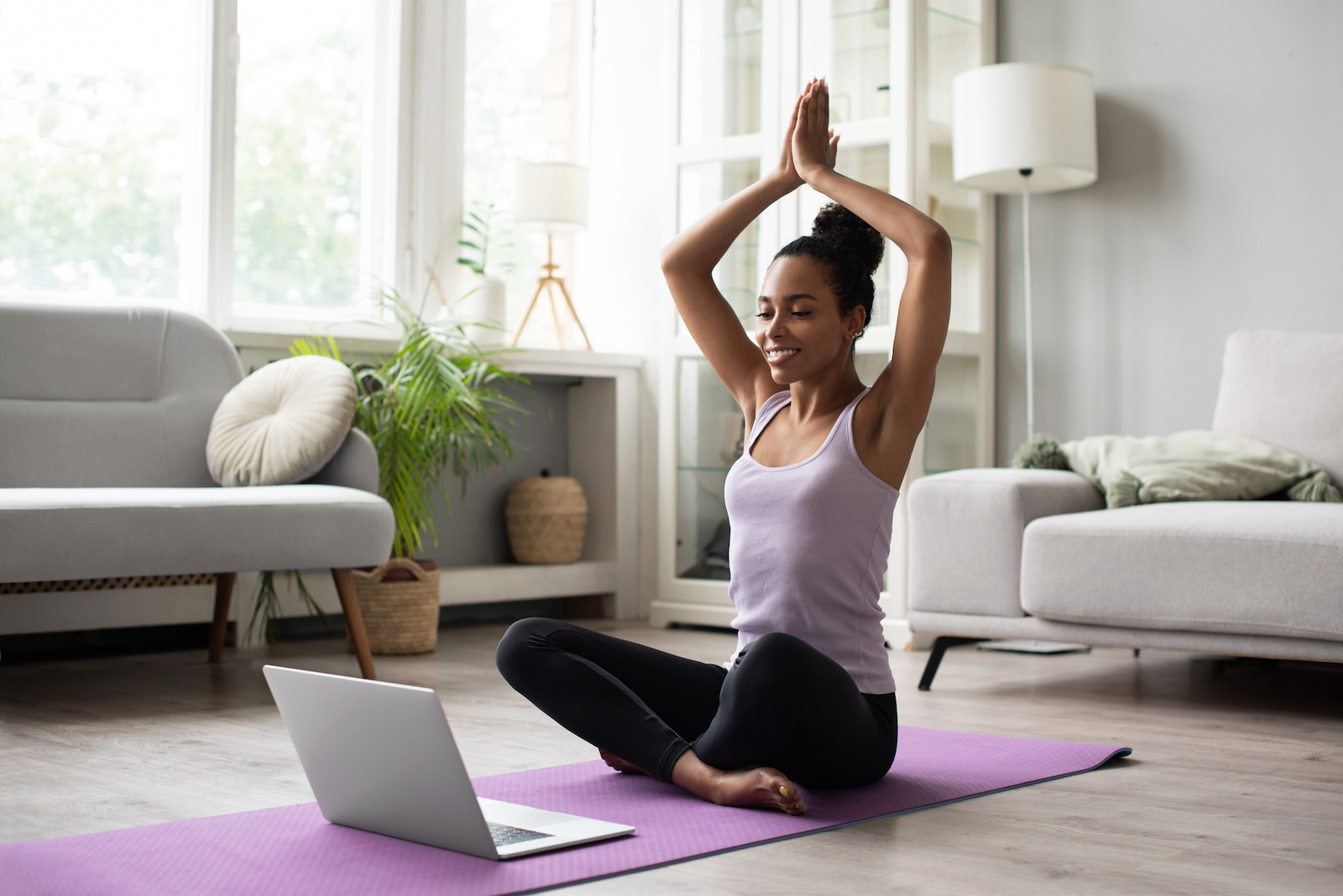 A woman taking care of her mental health with yoga