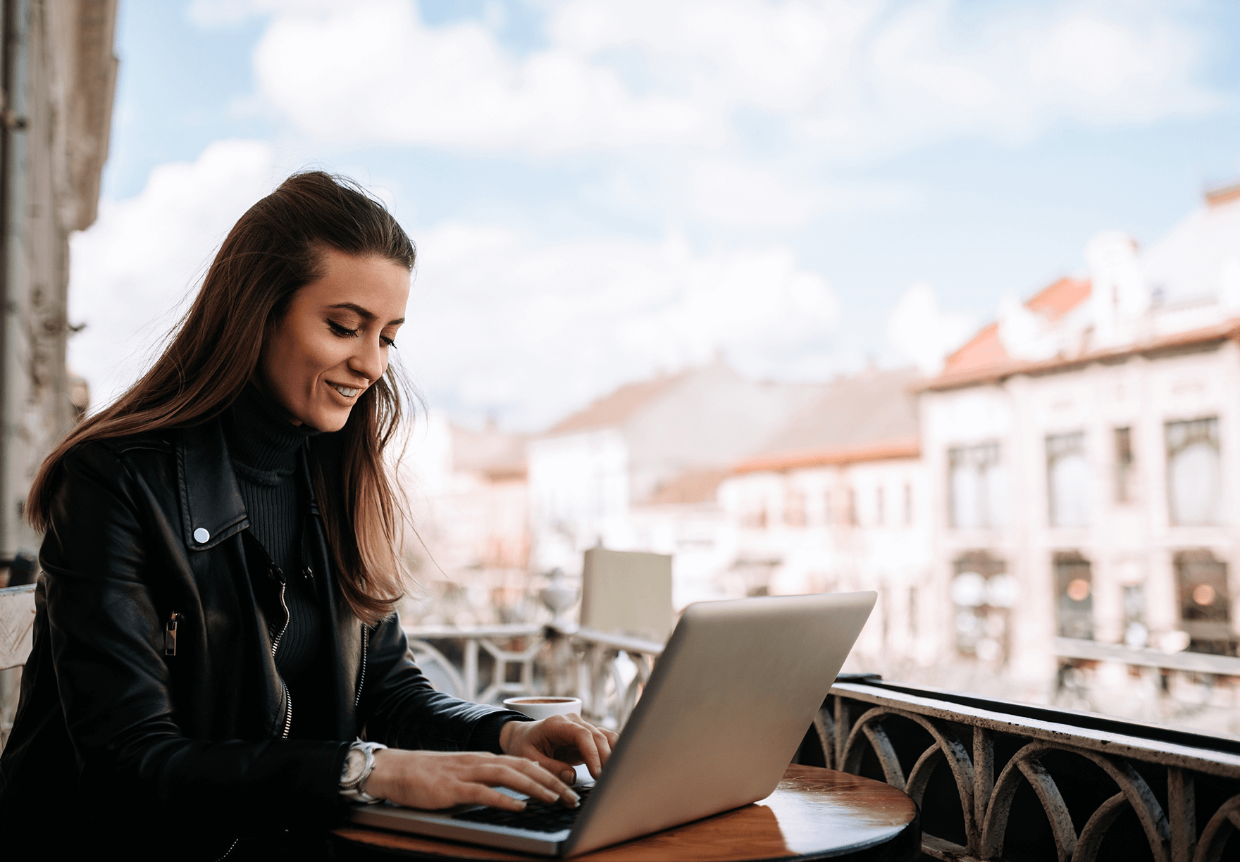 A woman working happily from a new country