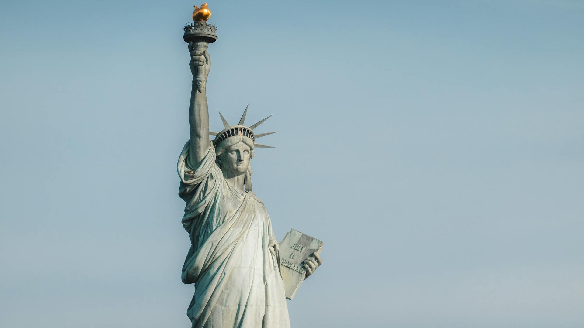 Wide lens shot of the Statue of Liberty in New York City.